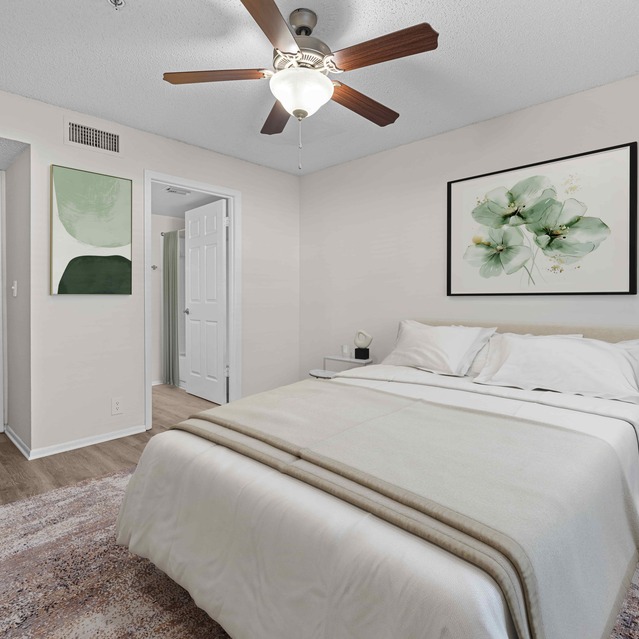 The Park at Veneto - A Cozy Bedroom Featuring a Queen Bed